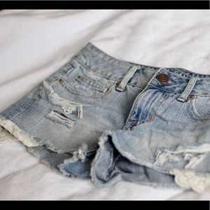 Ripped jean shorts with lace detail